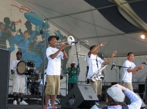 Baby Boyz at Jazz Fest. No longer the province of  old men, brass bands provide a path for young musicians to gain professional experience 